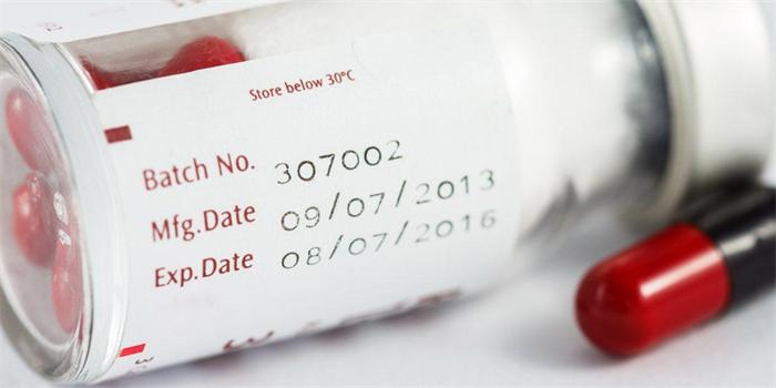 Close-up of prescription medicine label with batch number and expiry date
